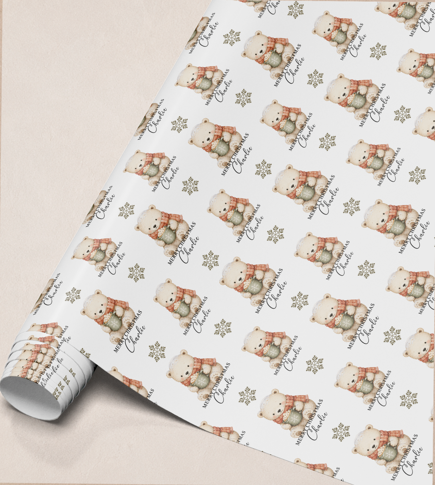 Close-up of the personalised polar bear Christmas gift wrap pattern showing the custom name detail