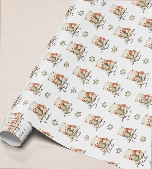 Close-up of the personalised polar bear Christmas gift wrap pattern showing the custom name detail