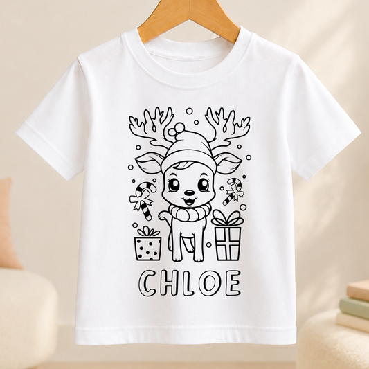 A white t-shirt with a black and white illustration of a cartoon reindeer wearing a hat and surrounded by Christmas-themed items such as presents and candy canes. The name " Chloe " is written below the illustration.