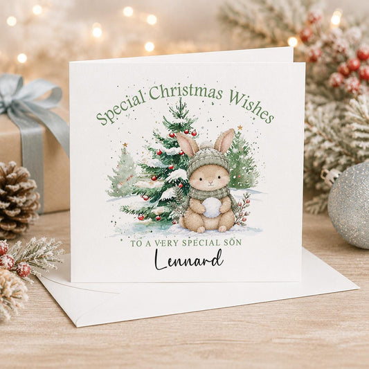 Personalised Christmas card, white 6x6 inch square card printed with a grey bunny between snowy trees, Special Christmas Wishes and a name