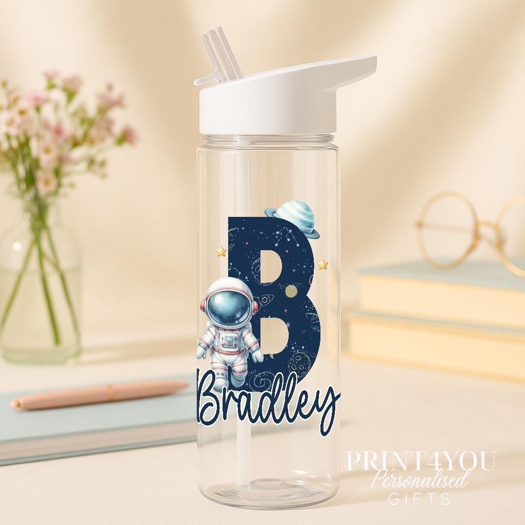 Personalised 750ml space-themed water bottle with flip straw lid, showing planets, an astronaut design and the child's custom name and initial