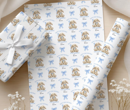 Roll of personalised pastel blue bunny wrapping paper shown in full pattern repeat.