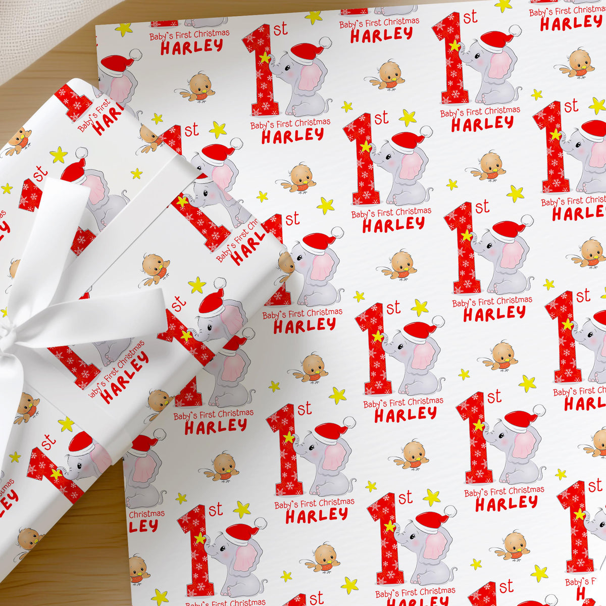 Personalised Baby's First Christmas elephant wrapping paper shown as a full sheet
