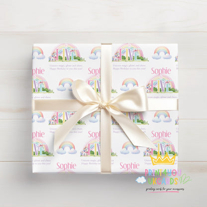 Personalised rainbow unicorn birthday wrapping paper wrapped around a gift
