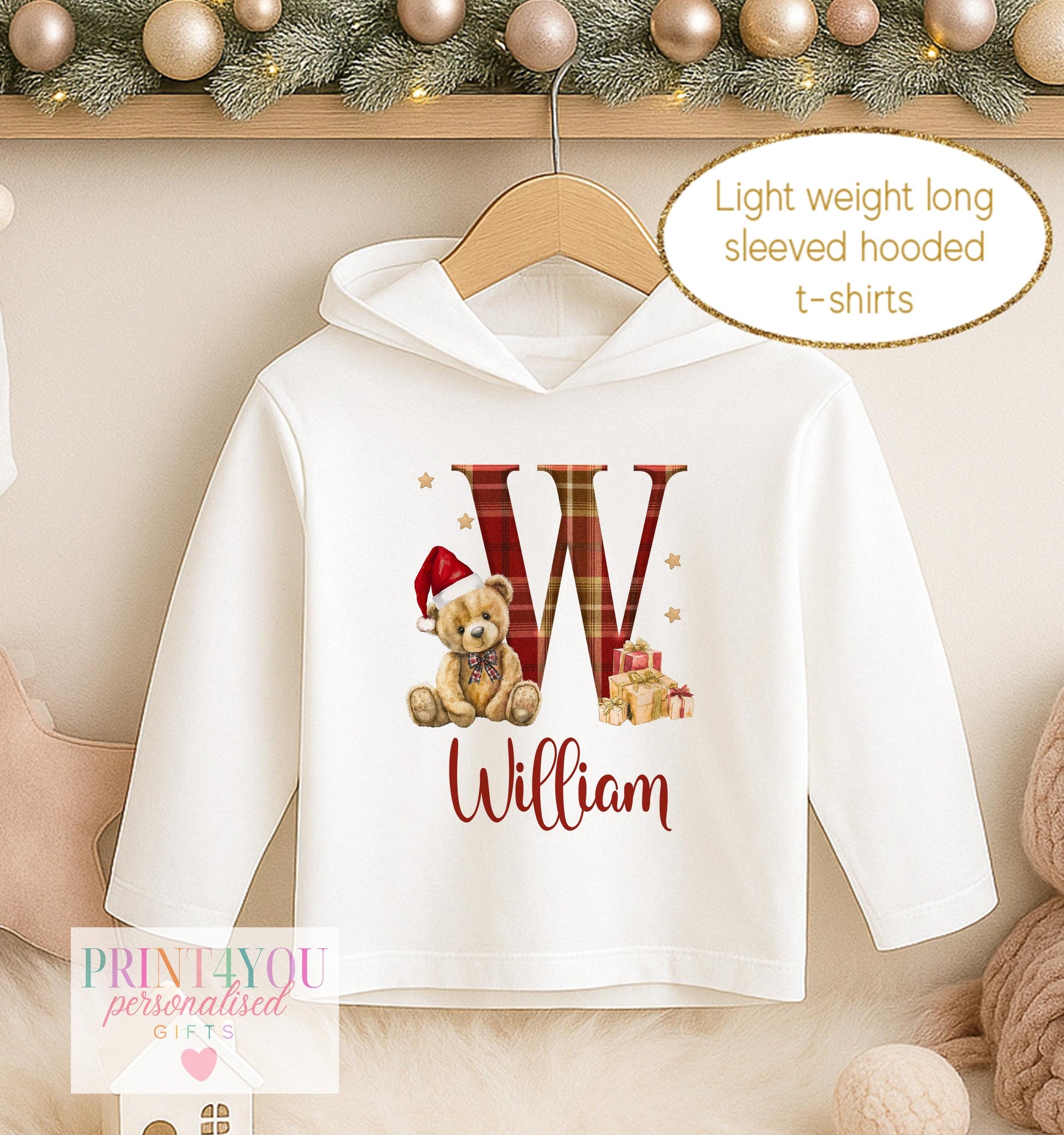 Personalised Christmas hooded t-shirt, white long sleeved hoodie printed with a red tartan initial, a teddy bear in a tartan bow and a name