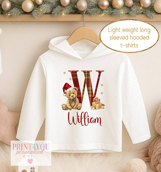 Personalised Christmas hooded t-shirt, white long sleeved hoodie printed with a red tartan initial, a teddy bear in a tartan bow and a name