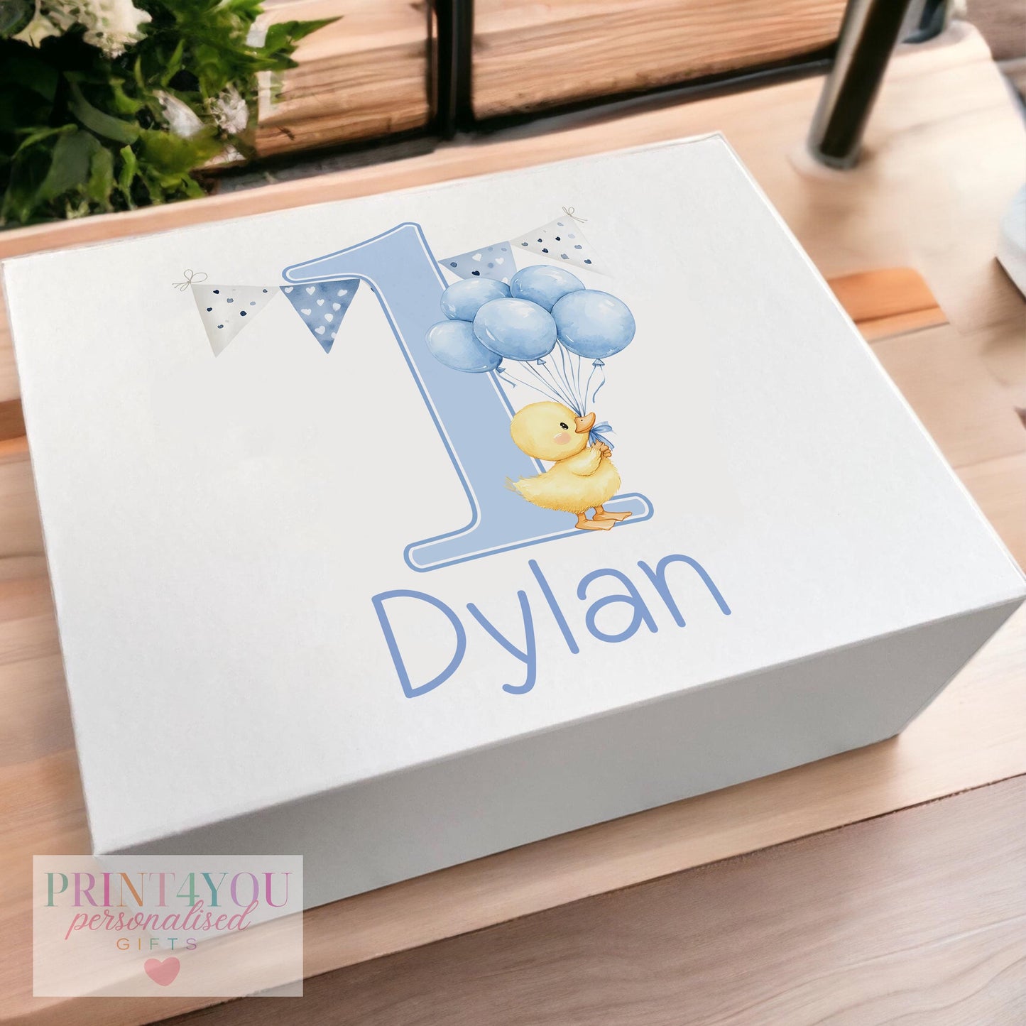 White magnetic keepsake box personalised with a child's name, decorated with a blue duck and birthday balloons