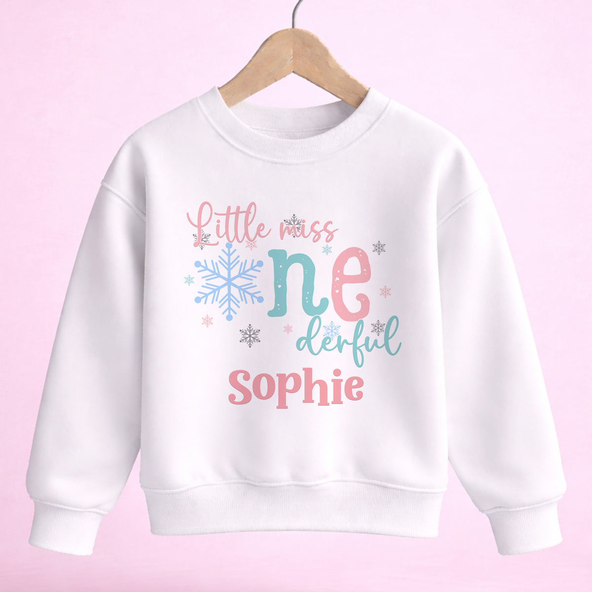 Little Miss ONEDERFUL personalised first birthday outfit, size 6-12 months, with pastel pink, mint and icy blue snowflake design