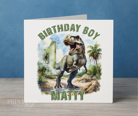 Personalised dinosaur birthday card, white 6x6 inch square card printed with Birthday Boy, a T-Rex, a large age number and a name