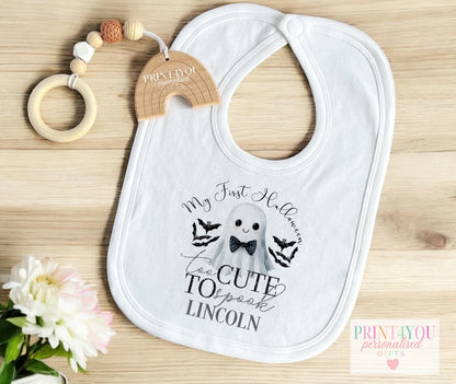 Personalised Halloween baby vest with bow-tie ghost design, laid flat to show full print.