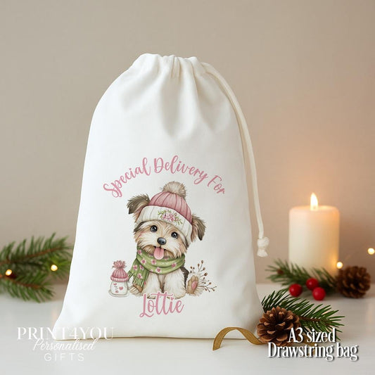 Personalised puppy Christmas sack, white A3 drawstring gift bag printed with a puppy in a pink bobble hat and Special Delivery For a name