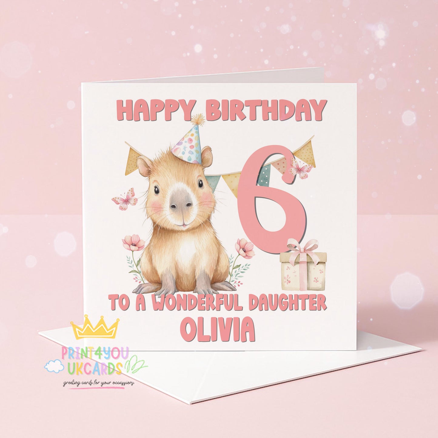Personalised birthday card featuring a capybara in a party hat surrounded by floral illustrations, printed with a custom name and age.
