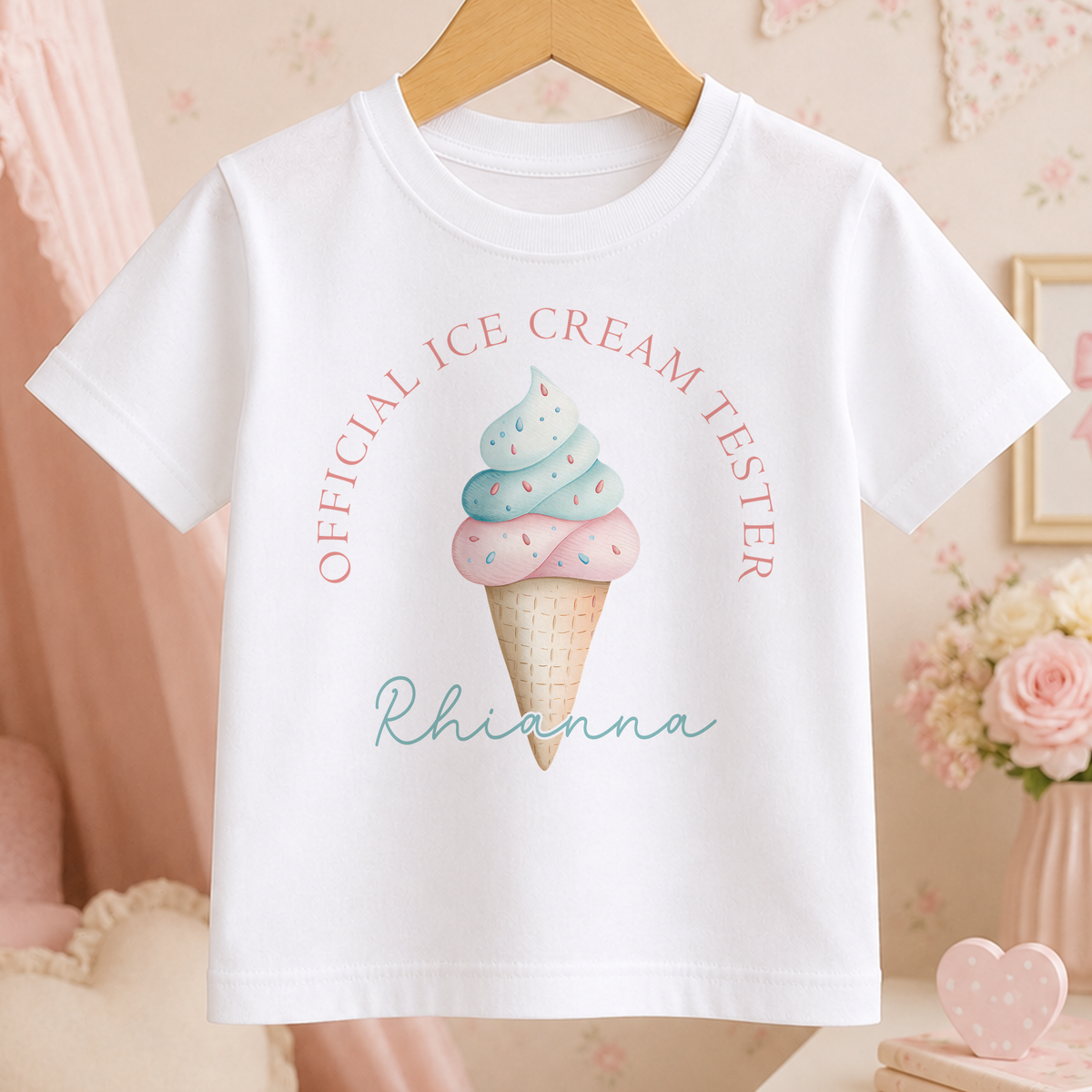 A white t-shirt with a graphic of an ice cream cone and the text "Official Ice Cream Tester Rhianna" printed on it.