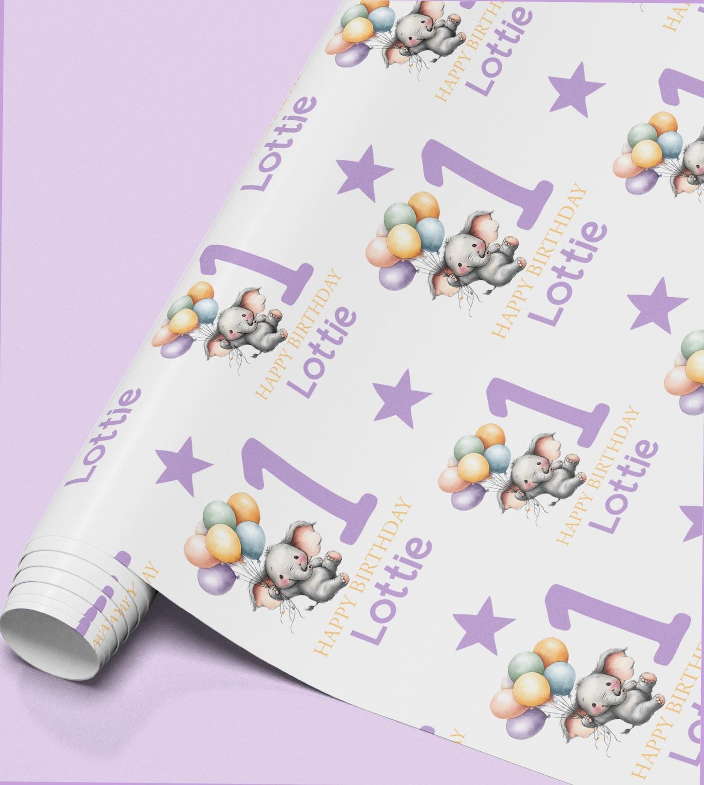 Roll of personalised purple elephant birthday wrapping paper printed with the name Lottie and a balloon design.