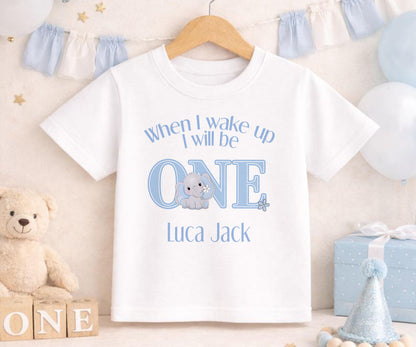 Personalised blue elephant first birthday outfit with custom name printed on soft cotton.