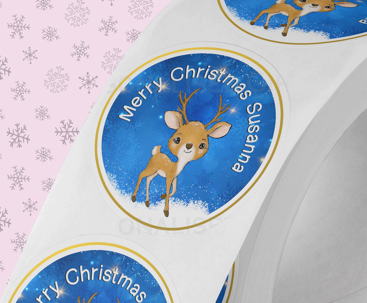 Close-up of a personalised Santa Father Christmas sticker with a custom name, showing the 5cm glossy round gift label detail