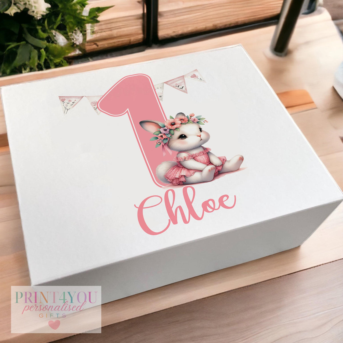 White magnetic-close keepsake box for a baby's first birthday, personalised with the child's name and printed with a pink ballerina bunny rabbit design, shown in the medium 160 x 200 x 80mm size