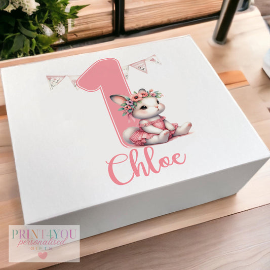 White magnetic-close keepsake box for a baby's first birthday, personalised with the child's name and printed with a pink ballerina bunny rabbit design, shown in the medium 160 x 200 x 80mm size