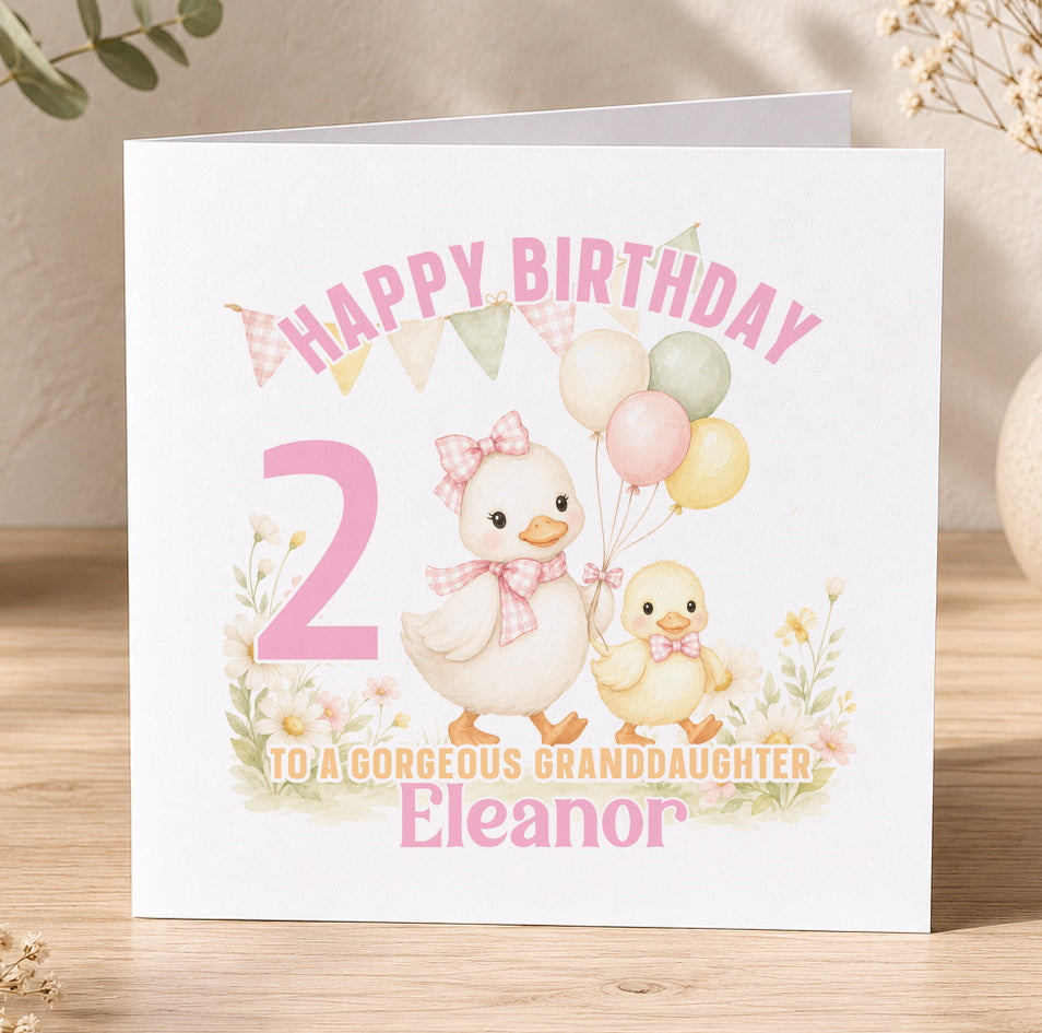 Personalised duck birthday card featuring two illustrated ducklings and pastel balloons, shown printed with the name Eleanor, age and birthday message.