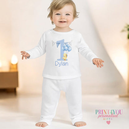 Blue duck personalised first birthday pyjamas for 6-12 months, printed with baby's name on soft white cotton.