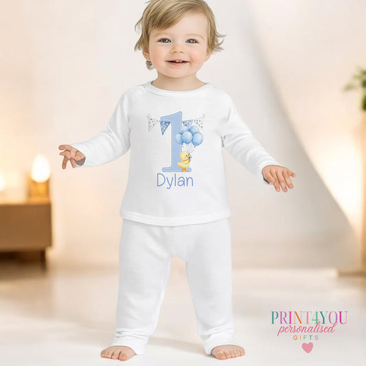 Blue duck personalised first birthday pyjamas for 6-12 months, printed with baby's name on soft white cotton.