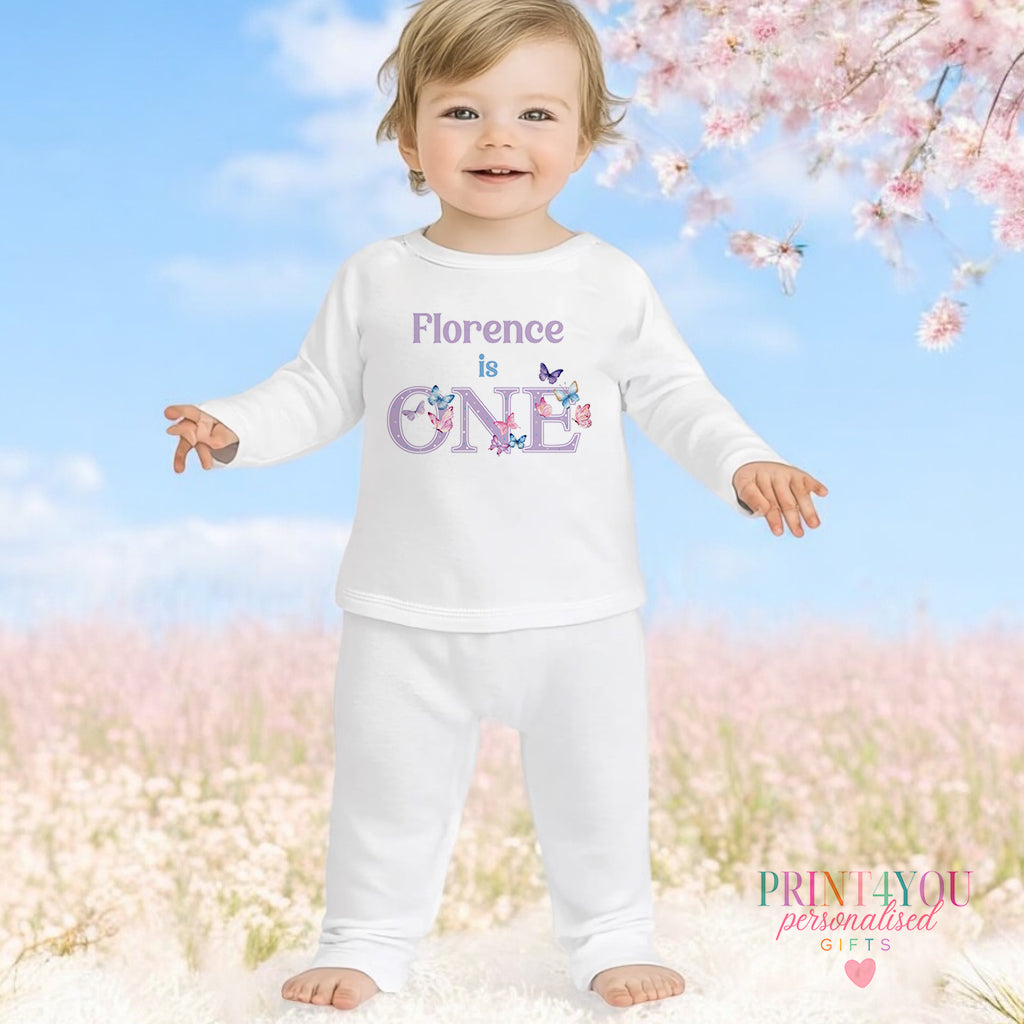 Purple butterfly personalised first birthday pyjamas for 1-2 years, printed with baby's name on soft white cotton.