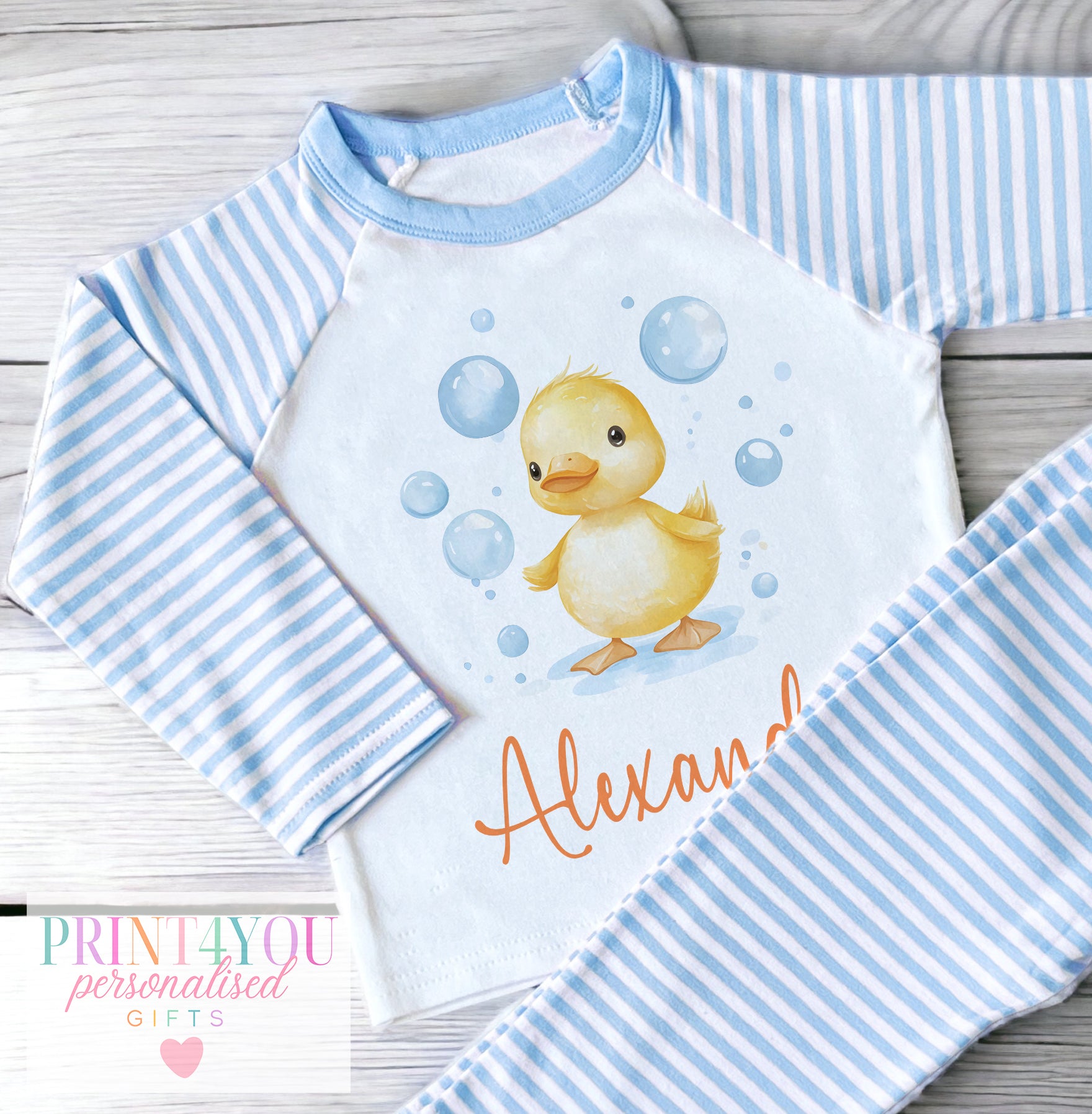 Personalised blue and white striped baby clothing with bubble duck design