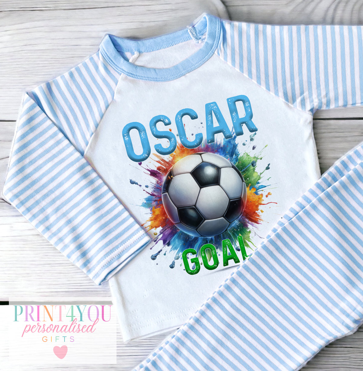 Personalised blue and white striped boys' pyjamas with a colourful paint-splash football design, personalised with child's name