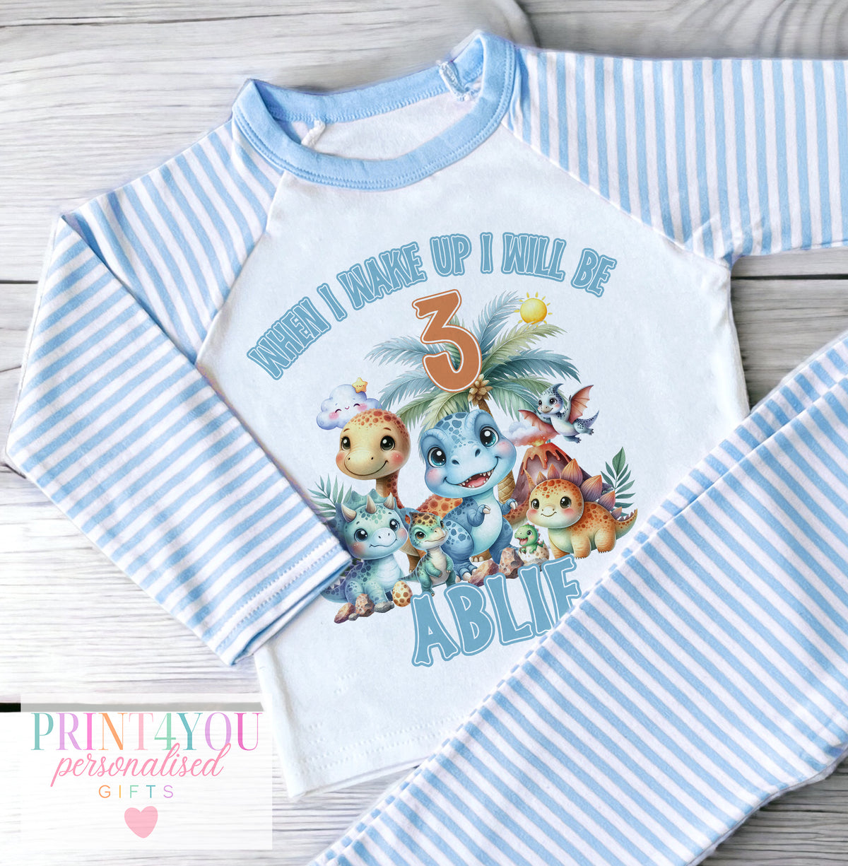 Personalised blue striped boys pyjamas with dinosaur when I wake up design, size 6-12 months