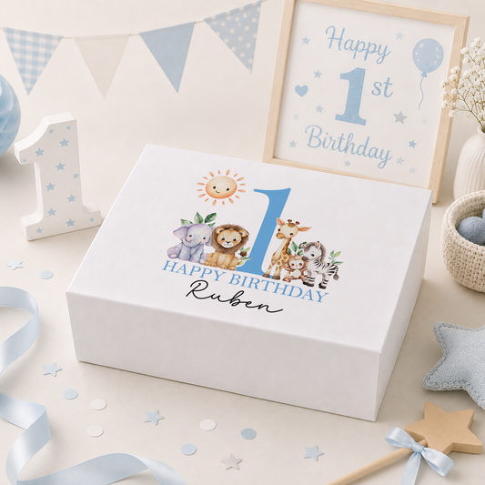Blue personalised 1st birthday keepsake box lid featuring a smiling sun above a lion, elephant, giraffe, monkey and zebra beside a large number one, with 'Happy Birthday' and the child's name in blue script