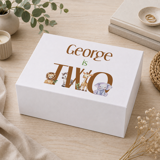Personalised safari animals 2nd birthday keepsake box in neutral brown, with a lion, zebra, giraffe and elephant spelling out TWO and the child's name printed above in script