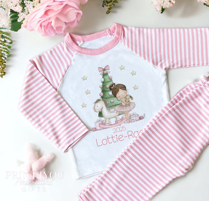 Personalised pink and white striped Christmas pyjamas for girls with storybook Ballerina by the Christmas tree design and custom name on the front