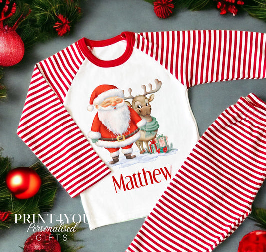Personalised red and white striped Christmas Eve pyjamas for kids with Santa and Reindeer design and custom name printed on the front