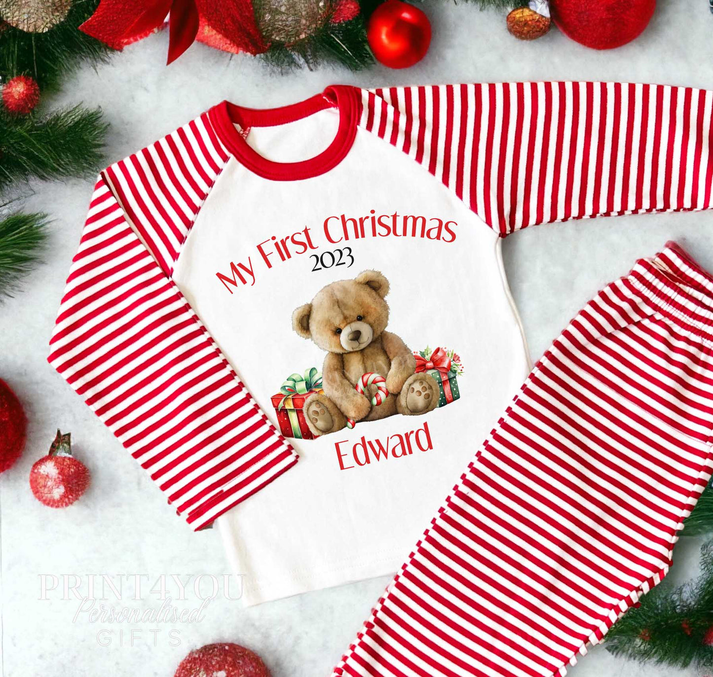 Personalised My First Christmas teddy bear pyjamas with a baby's name on red and white striped nightwear