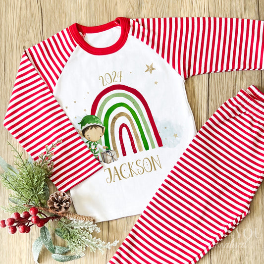 Personalised red and white striped Christmas Eve pyjamas for kids with cheerful Rainbow Elf design and custom name printed on the front