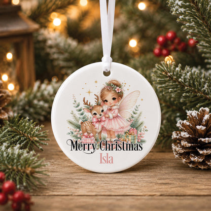 Personalised fairy Christmas bauble, white ceramic ornament with a pink fairy and a little deer, printed with Merry Christmas and a name