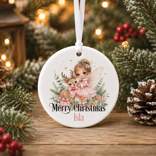 Personalised fairy Christmas bauble, white ceramic ornament with a pink fairy and a little deer, printed with Merry Christmas and a name