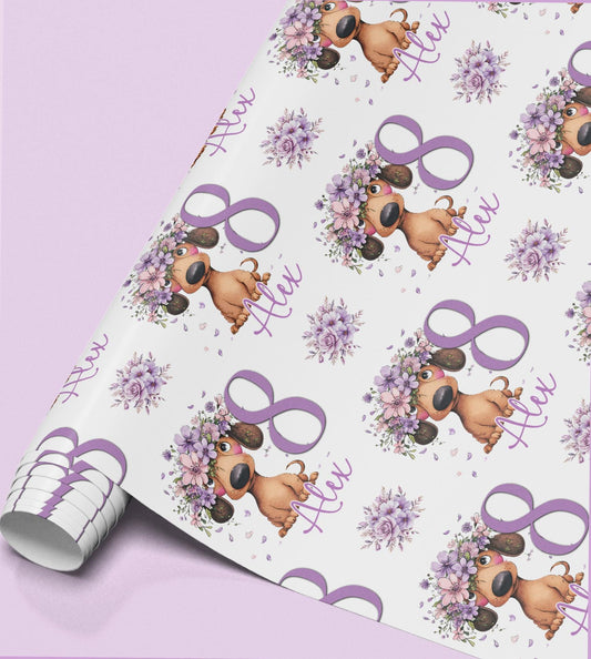 Roll of personalised lilac floral dachshund birthday wrapping paper with a repeating dog in a flower crown, custom age '8' and the name 'Alex'.
