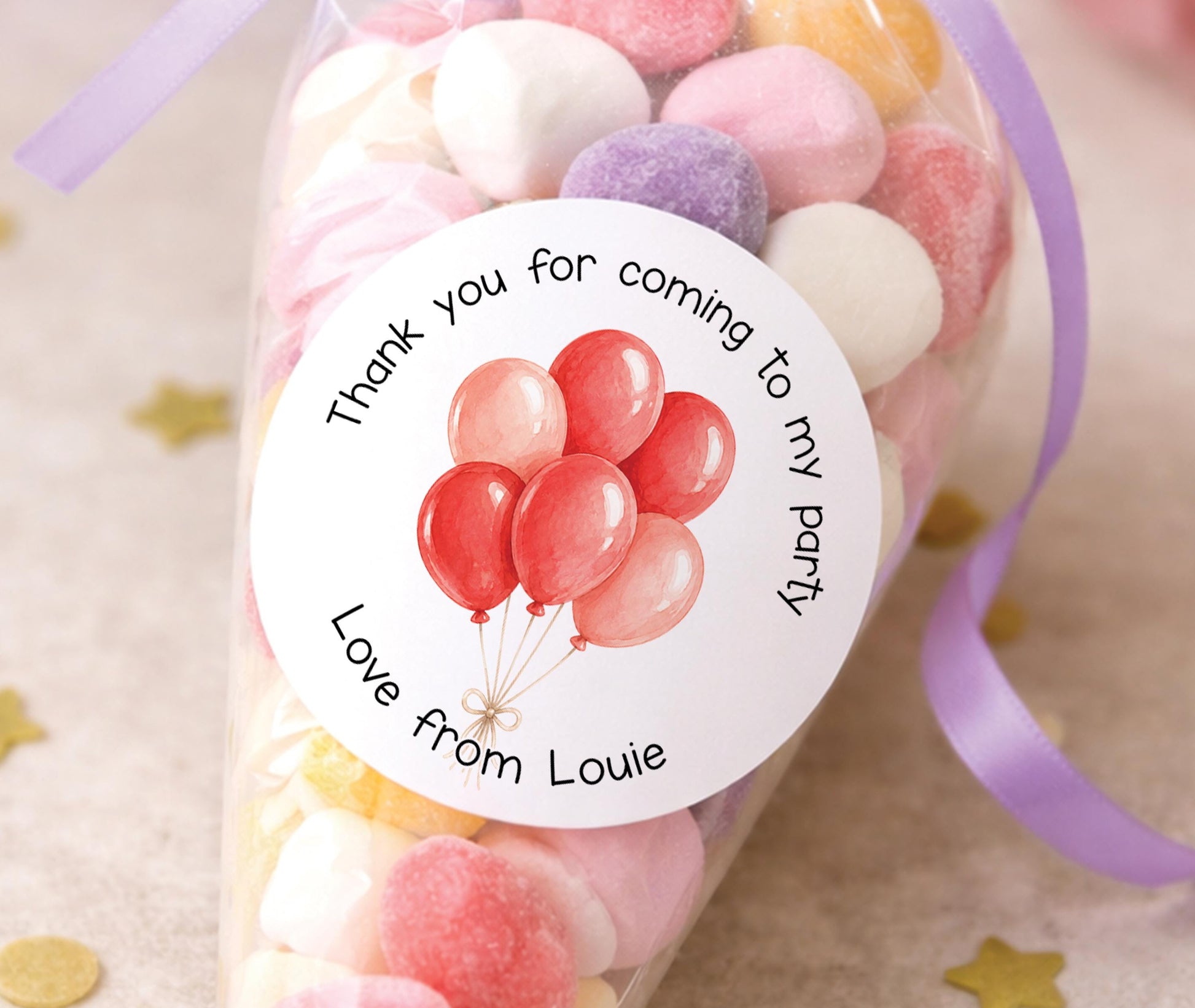 Round glossy stickers featuring a colourful balloon design, personalised with a child's name, for birthday party bags