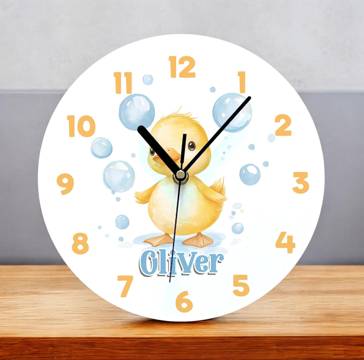 Personalised yellow duck acrylic nursery clock, 24.5cm, with glossy white face and space for a child's name