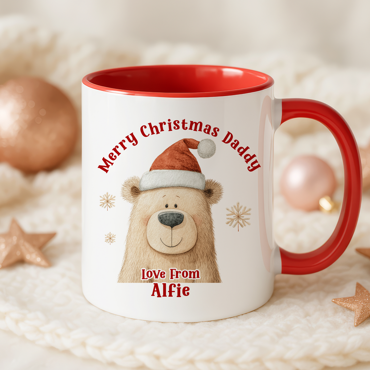 A red and white mug with a picture of a bear wearing a Santa hat and the text "Merry Christmas Daddy Love From Alfie" printed on it.