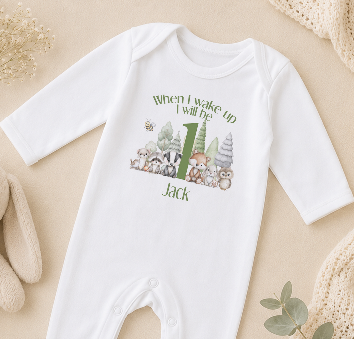 A white onesie with a graphic of animals and the text "When I wake up I will be Jack" printed on it.