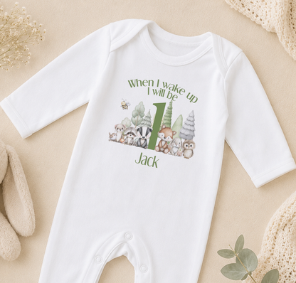 A white onesie with a graphic of animals and the text "When I wake up I will be Jack" printed on it.