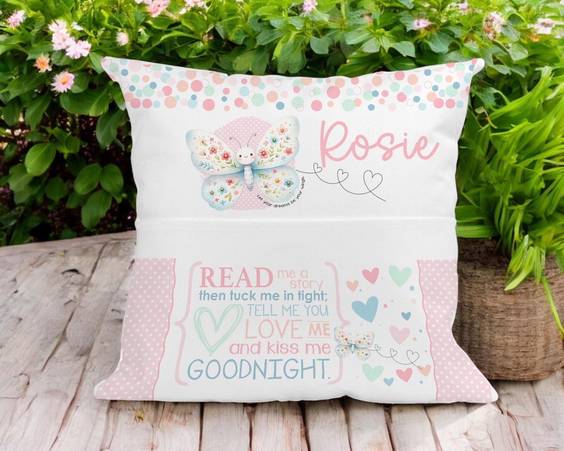 Personalised butterfly book cushion styled on a child's bed
