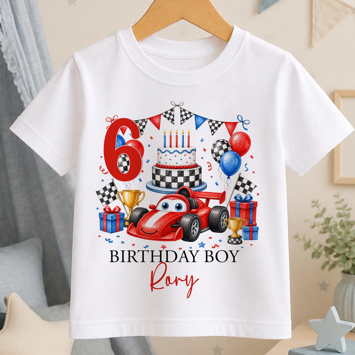 White cotton t-shirt printed with a red race car, chequered cake and trophies beside a large age number, with Birthday Boy and a name below.