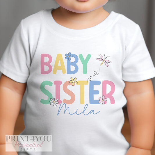Personalised new baby sister bib, shown in soft white cotton.