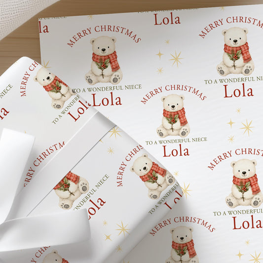 Personalised Christmas wrapping paper featuring a cute polar bear with holly and a festive red scarf, custom name and relation Christmas gift wrap.