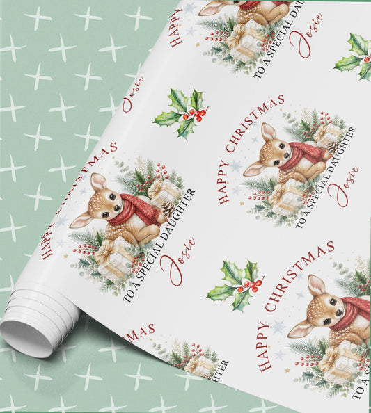 Rolled sheet of personalised deer Christmas wrapping paper printed with a name and relation
