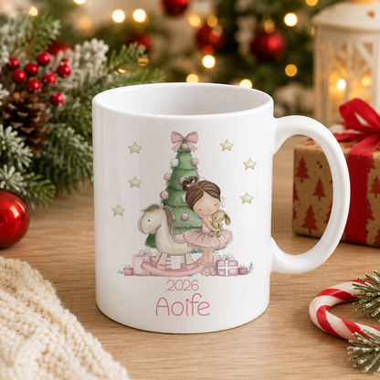 A white mug with a Christmas-themed illustration of a girl and a horse, surrounded by holiday decorations such as pine branches, ornaments, and a lit Christmas tree.