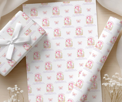 Close-up of the personalised pink butterfly wrapping paper with a floral age number and custom name